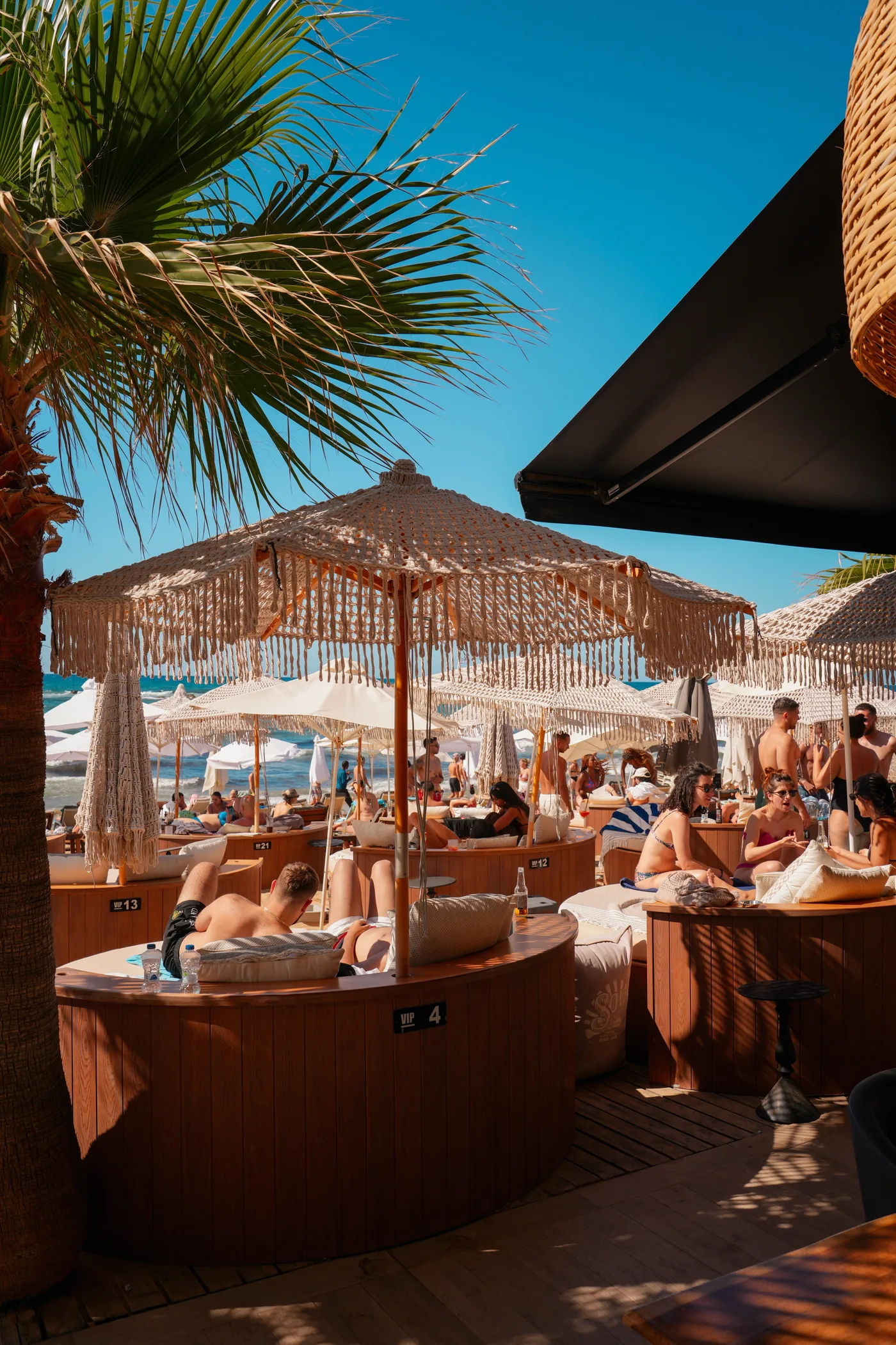 Pleasure Beach Club beneath woven parasols