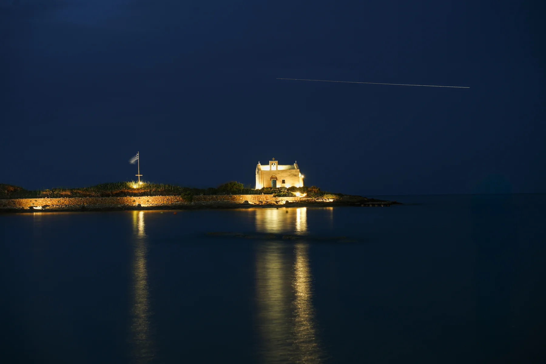 The Malia islet illuminated at night